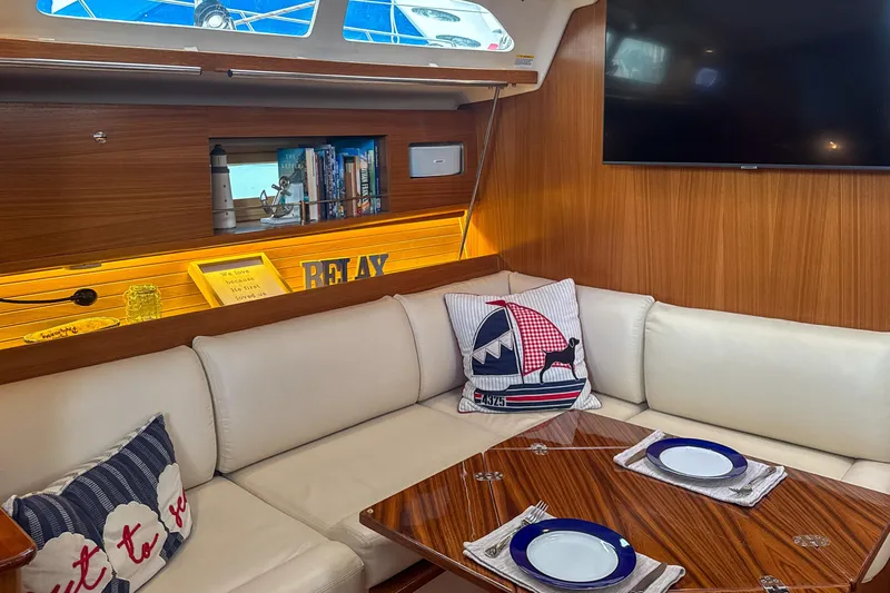 Slide: The Image of Cozy cabin bed in 2022 Catalina 385 yacht with nautical-themed pillows. - 36