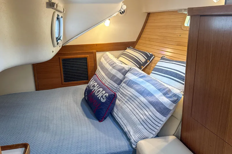 Slide: The Image of Interior of 2022 Catalina 385 yacht bathroom with shower and porthole window. - 45