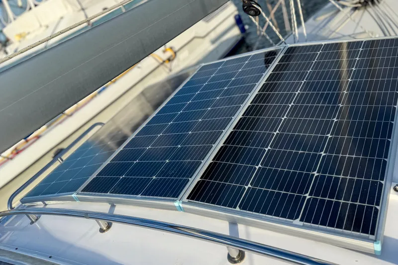 Slide: The Image of Control panel of a 2022 Catalina 385 sailboat with various electronic displays and controls. - 48