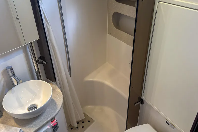 Slide: The Image of Solar panels on a 2022 Catalina 385 yacht docked at a marina. - 53