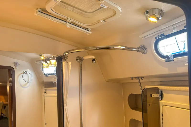 Slide: The Image of Dakota Lithium 12V 320Ah battery in Catalina 385, 2022 model, with red cables connected. - 54