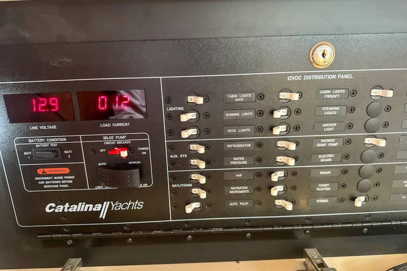 Slide: The Image of Mast of 2022 Catalina 385 sailboat against clear blue sky. - 58