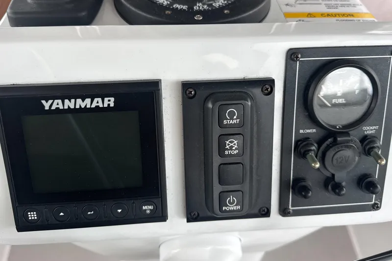 Slide: The Image of White Bose speaker mounted on wooden panel inside a 2022 Catalina 385. - 69