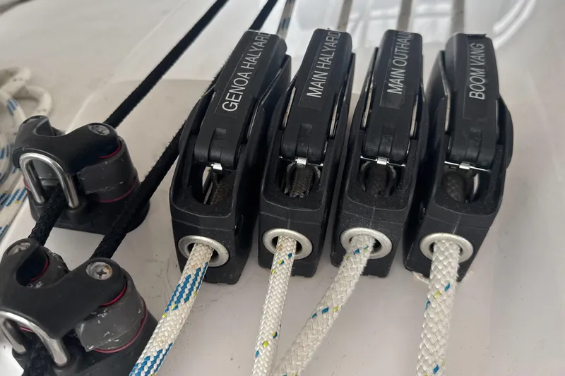 Slide: The Image of Close-up of Catalina 385 sailboat rigging system, featuring ropes and pulleys, 2022 model. - 71