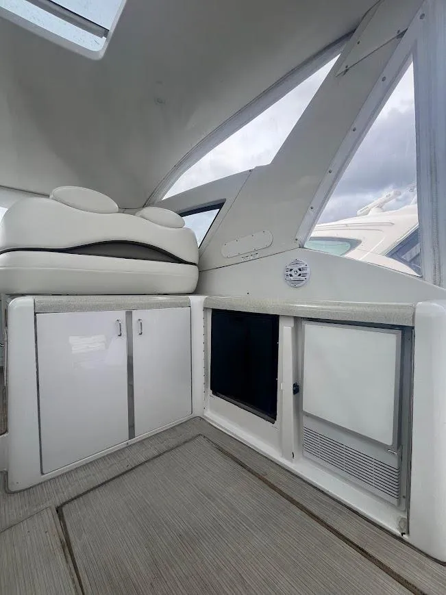 Slide: The Image of Interior of 2000 Carver 440 Hardtop Express yacht, featuring sleek cabinetry and modern design. - 8