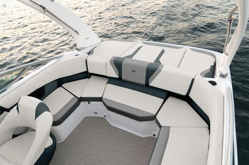 Slide: The Image of Luxurious seating on 2026 Regal 2000 ES boat, overlooking serene water. - 10