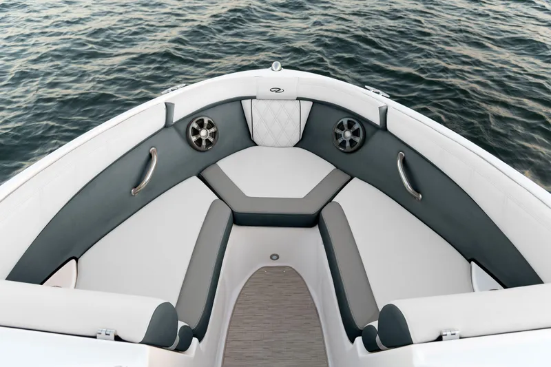 Slide: The Image of 2026 Regal 2000 ES boat in a showroom, rear view with outboard motor. - 2