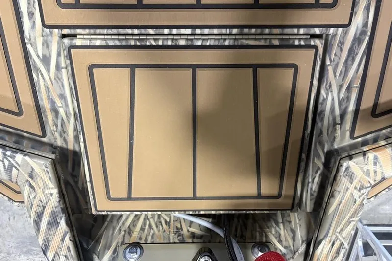 Slide: The Image of 2026 Tracker Grizzly 1650 T Prairie Wings Edition with camouflage design and control panel. - 14