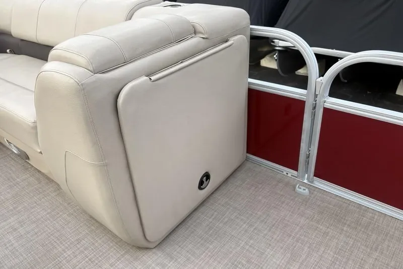 Slide: The Image of 2019 Sun Tracker Fishin' Barge 20 DLX, beige seating, red panel, boat interior. - 10