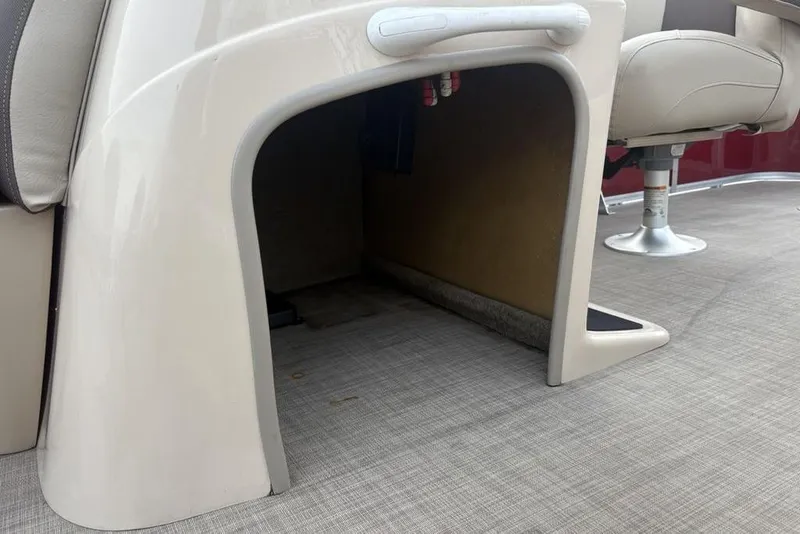Slide: The Image of 2019 Sun Tracker Fishin' Barge 20 DLX interior detail with seating and flooring. - 19