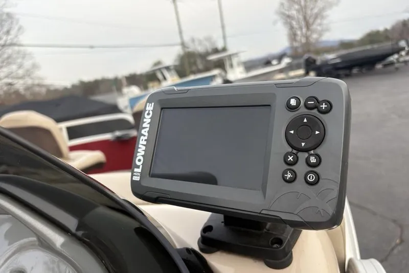 Slide: The Image of Lowrance fish finder on 2019 Sun Tracker Fishin' Barge 20 DLX boat, outdoor setting. - 20