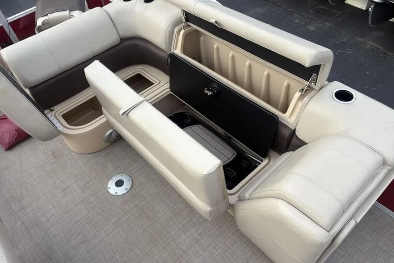 Slide: The Image of 2019 Sun Tracker Fishin' Barge 20 DLX interior with open storage compartments. - 26