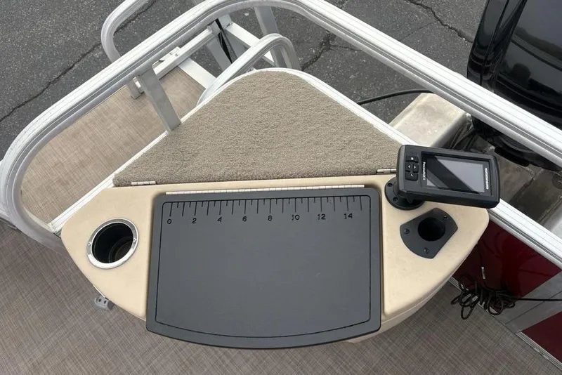 Slide: The Image of 2019 Sun Tracker Fishin' Barge 20 DLX fishing station with measuring board and fish finder. - 31