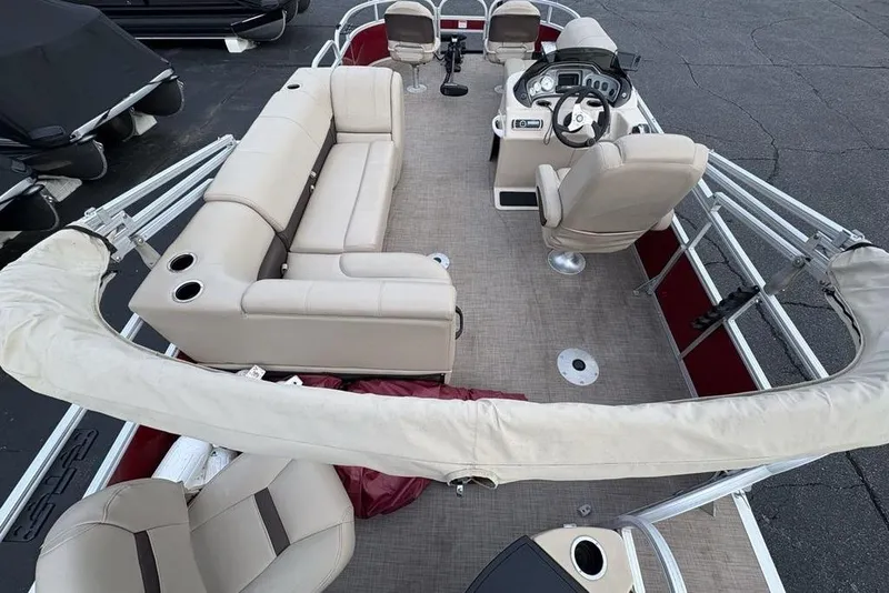 Slide: The Image of 2019 Sun Tracker Fishin' Barge 20 DLX pontoon boat with beige seating and steering console. - 33