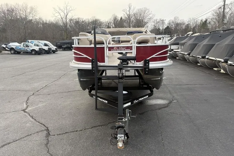 Slide: The Image of 2019 Sun Tracker Fishin' Barge 20 DLX pontoon boat on trailer in parking lot. - 5