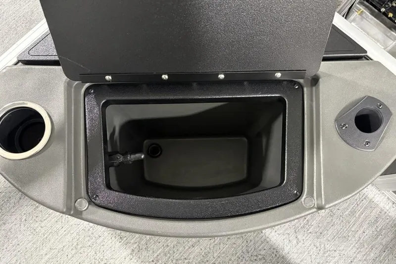 Slide: The Image of Open storage compartment on 2026 Sun Tracker Bass Buggy 18 DLX boat. - 18