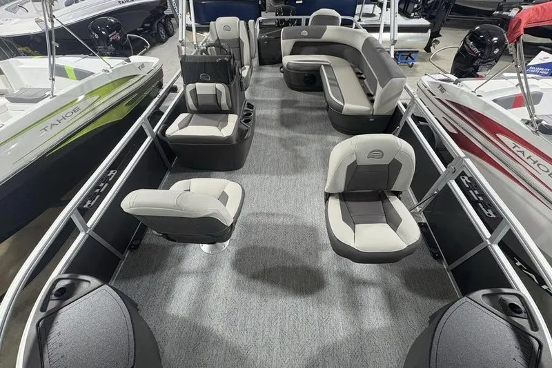 Slide: The Image of 2026 Sun Tracker Bass Buggy 18 DLX pontoon boat interior with seating and modern design. - 25