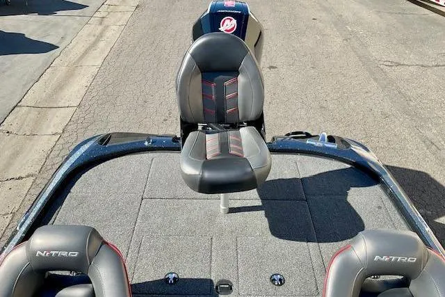 Slide: The Image of 2024 Nitro Z20 Pro boat interior with seating and carpeted deck. - 12
