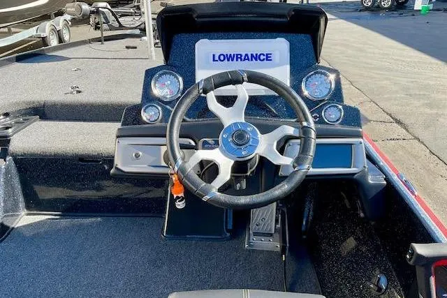 Slide: The Image of 2024 Nitro Z20 Pro boat dashboard with steering wheel and Lowrance display. - 15