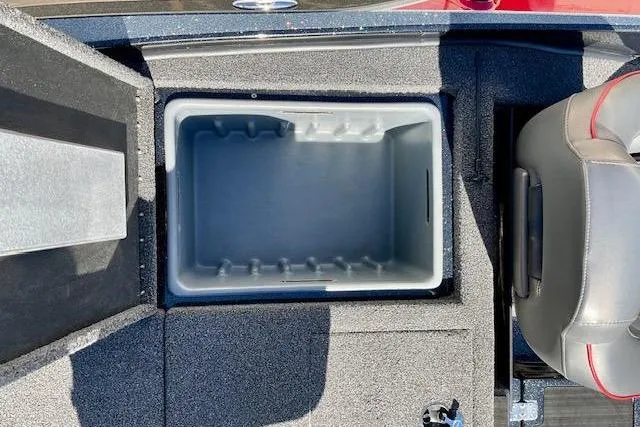 Slide: The Image of 2024 Nitro Z20 Pro boat storage compartment with gray interior and adjacent seating. - 17