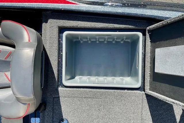 Slide: The Image of 2024 Nitro Z20 Pro boat storage compartment with open lid and adjacent seating. - 18