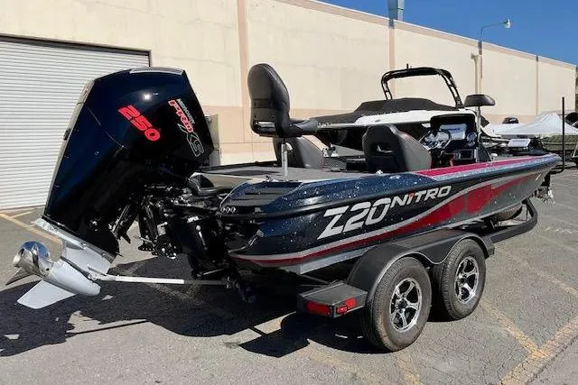 Slide: The Image of 2024 Nitro Z20 Pro boat with powerful 250 engine, parked outdoors. - 25
