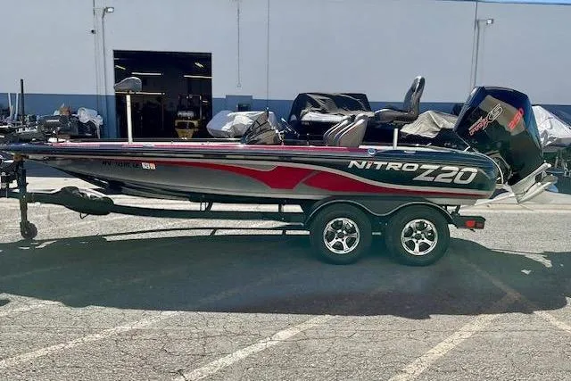 Slide: The Image of 2024 Nitro Z20 Pro fishing boat on trailer, parked outdoors. - 3