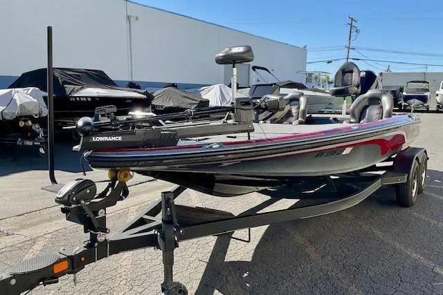 Slide: The Image of 2024 Nitro Z20 Pro fishing boat on trailer, equipped with Lowrance electronics. - 4