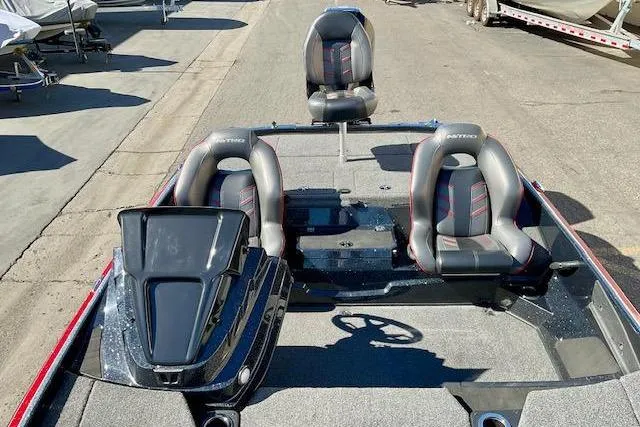 Slide: The Image of 2024 Nitro Z20 Pro boat interior with three seats and steering wheel. - 9