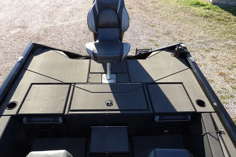 Slide: The Image of 2026 Lund 1975 Renegade boat interior with seating and storage compartments. - 12