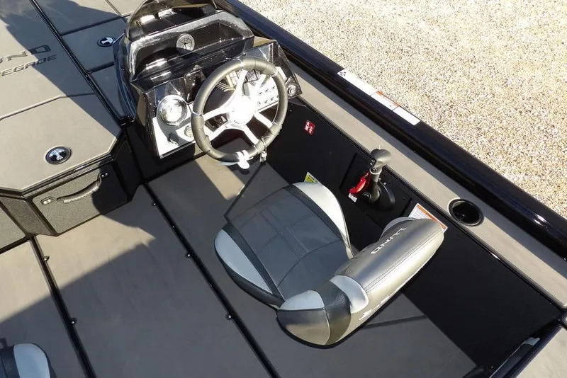 Slide: The Image of Interior of 2026 Lund 1975 Renegade boat with steering wheel and seat. - 19