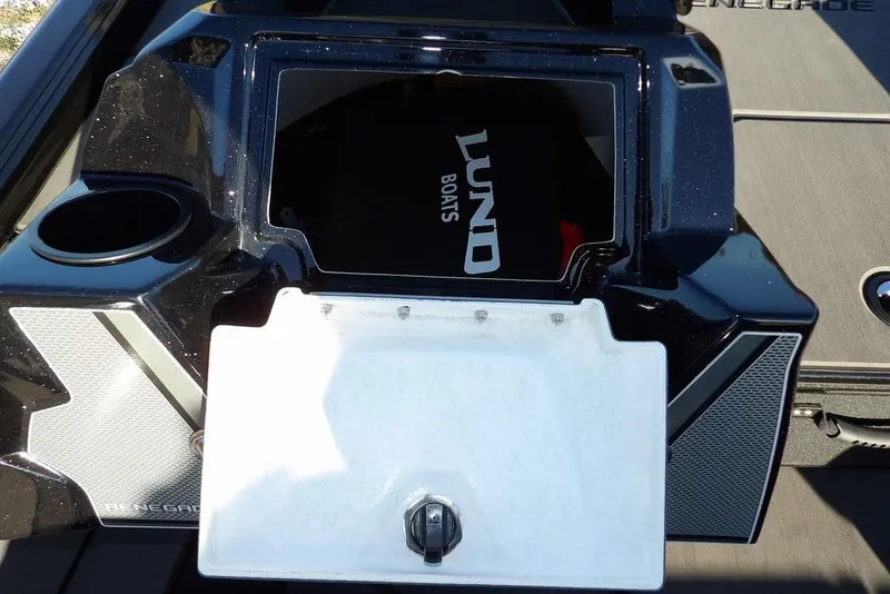 Slide: The Image of 2026 Lund 1975 Renegade boat dashboard with storage compartment and cup holder. - 23