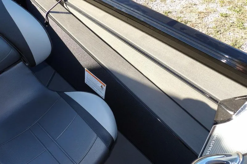 Slide: The Image of Interior of 2026 Lund 1975 Renegade boat with gray seating and sleek design. - 29