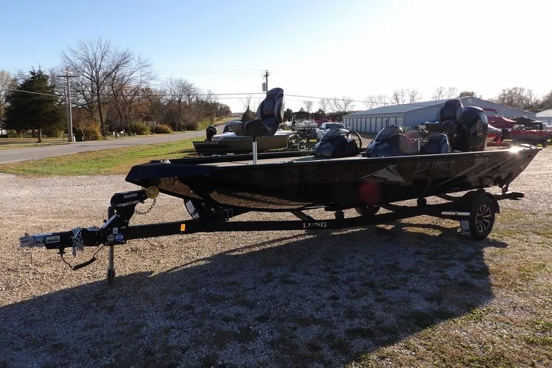 Slide: The Image of 2026 Lund 1975 Renegade boat on trailer in outdoor setting. - 3