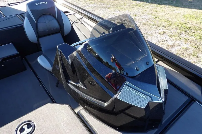 Slide: The Image of 2026 Lund 1975 Renegade boat interior with sleek black console and comfortable seating. - 30