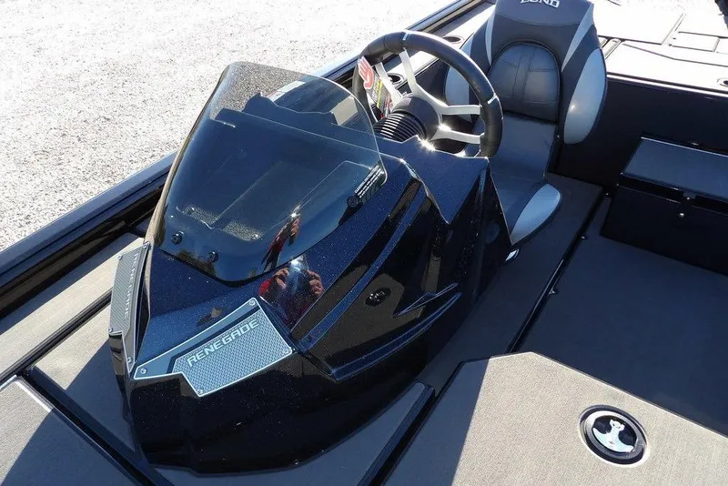 Slide: The Image of 2026 Lund 1975 Renegade boat cockpit with steering wheel and seat. - 34