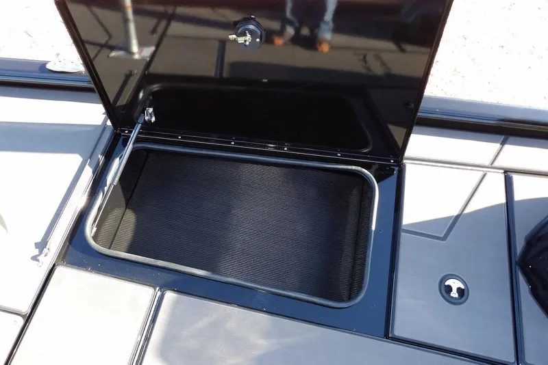 Slide: The Image of Open storage compartment on 2026 Lund 1975 Renegade boat deck. - 37