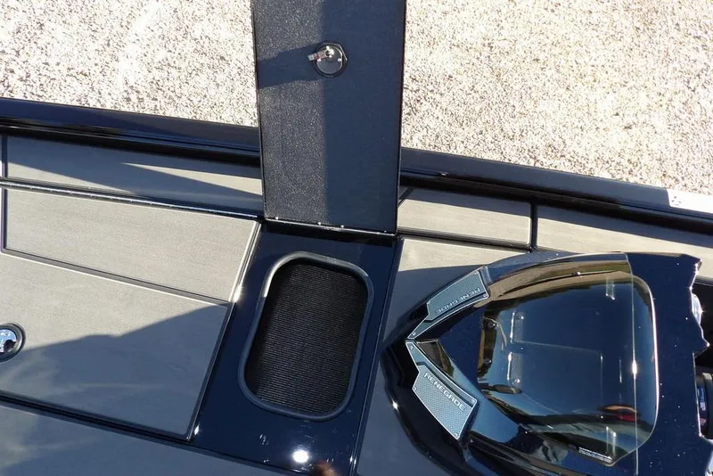 Slide: The Image of 2026 Lund 1975 Renegade boat deck with storage compartment and sleek design. - 38