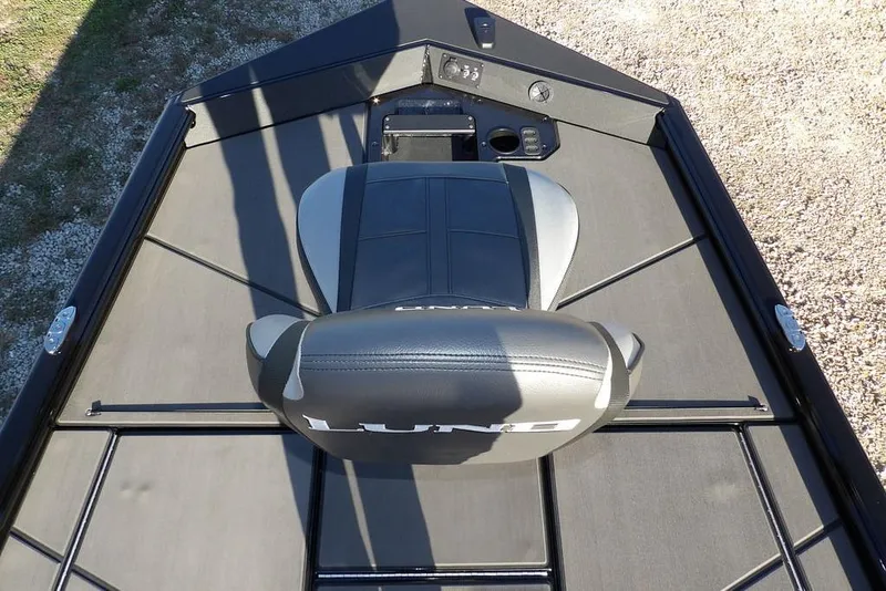 Slide: The Image of 2026 Lund 1975 Renegade boat interior with seating and control panel. - 40