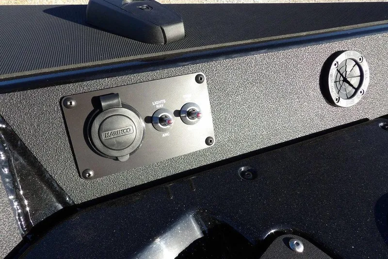 Slide: The Image of Control panel of 2026 Lund 1975 Renegade boat with switches and outlets. - 44