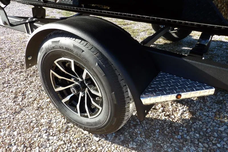 Slide: The Image of 2026 Lund 1975 Renegade trailer wheel with black alloy rim and diamond plate step. - 48