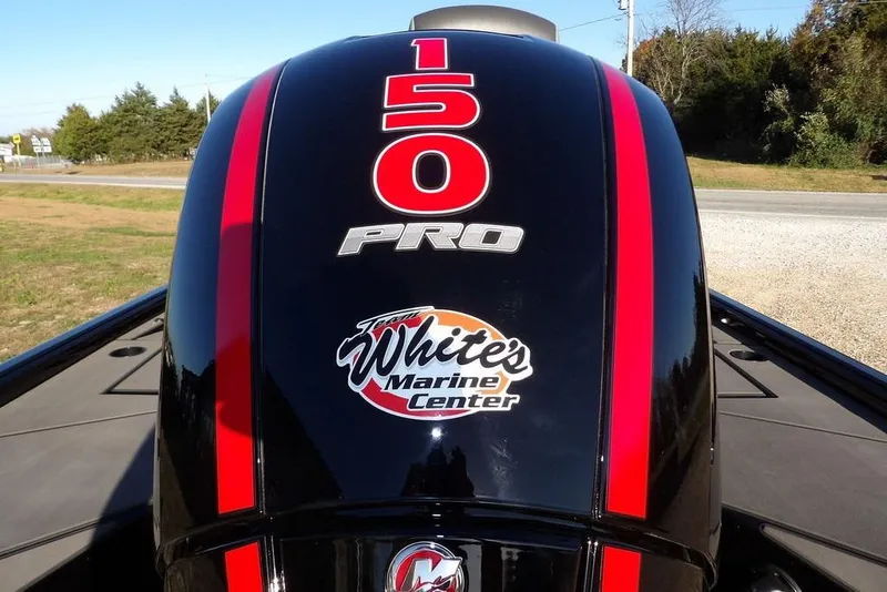 Slide: The Image of Outboard motor with "150 Pro" and "White's Marine Center" logo, Lund 1975 Renegade, 2026 model. - 51