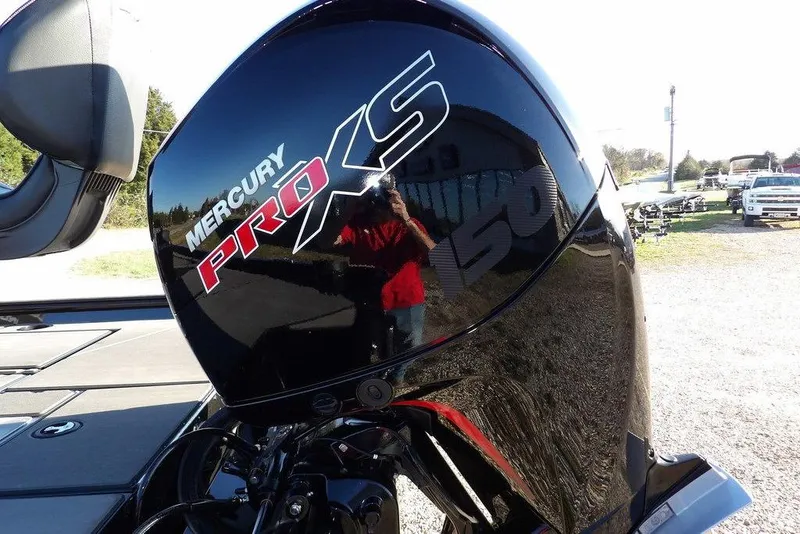 Slide: The Image of Mercury Pro XS 150 engine on 2026 Lund 1975 Renegade boat, outdoor setting. - 53