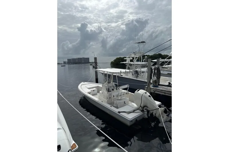 Slide: The Image of 2000 Pathfinder 2400 Tournament Edition boat docked on a cloudy day. - 3