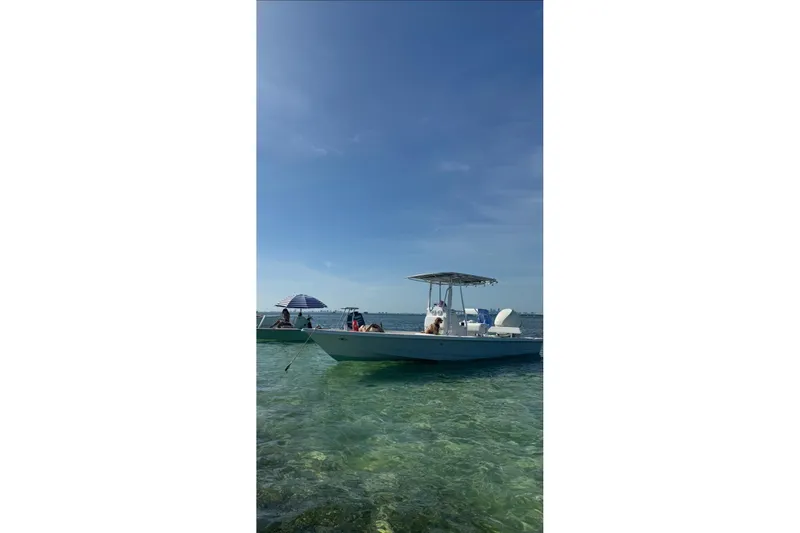 Slide: The Image of Pathfinder 2400 Tournament Edition boat on clear water, sunny day, 2000 model. - 4