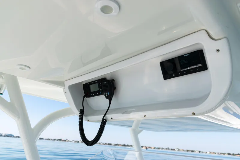 Slide: The Image of 2014 Yellowfin 36 Offshore boat console with radio and control panel. - 34