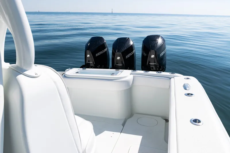 Slide: The Image of 2014 Yellowfin 36 Offshore boat with triple Mercury engines on calm sea. - 35