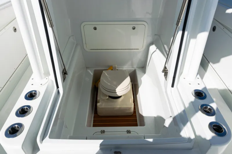 Slide: The Image of 2014 Yellowfin 36 Offshore boat interior with compact marine toilet. - 41
