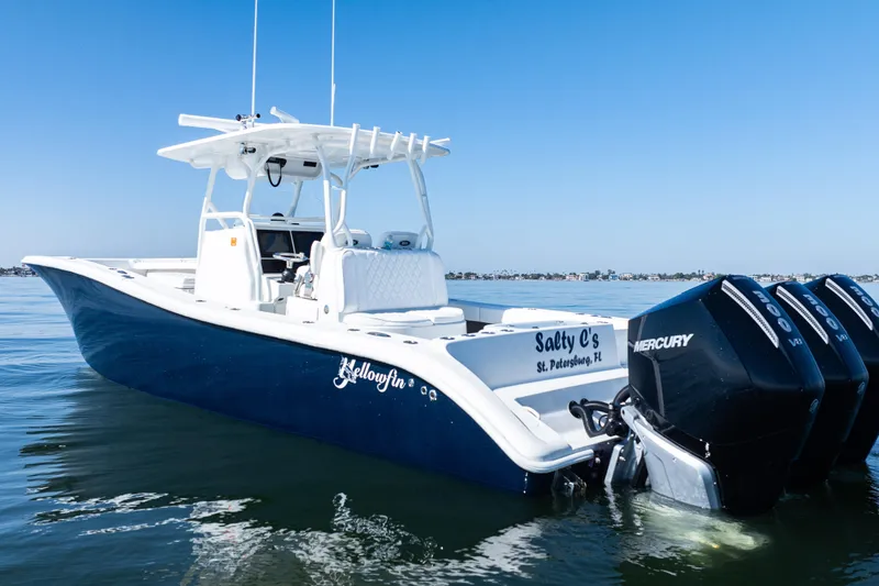 Slide: The Image of 2014 Yellowfin 36 Offshore boat with triple Mercury engines on calm water. - 6