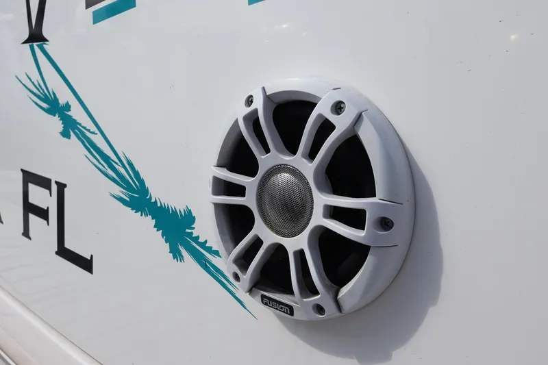 Slide: The Image of Close-up of a Fusion speaker on a 2022 Regal 38 SAV boat exterior. - 25